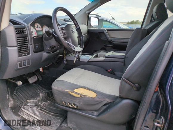2011 Nissan Titan Pro-4X with VIN 1N6BA0EC3BN322837, listed as a Copart auction lot 60617675 with 196,657 mi miles and Salvage title. Bid and sale history available at DreamBid. Image 7.