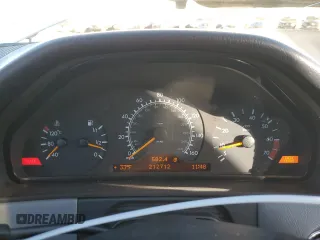 1999 Mercedes-Benz E-Class with VIN WDBJF82H1XX024280, listed as a Copart auction lot 83213204 with 212,712 mi miles and Salvage Title. Bid and sale history available at carsss.com. Image 9.