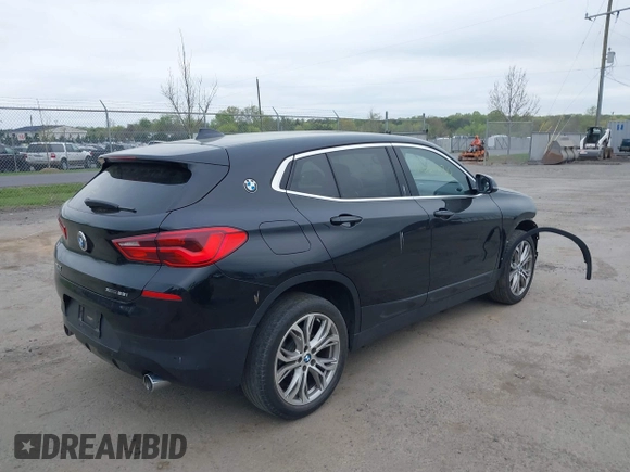 2018 BMW X2 xDrive28i with VIN WBXYJ5C34JEF72637, listed as a IAAI auction lot 42064330 with 96,725 mi miles. Bid and sale history available at carsss.com. Image 4.
