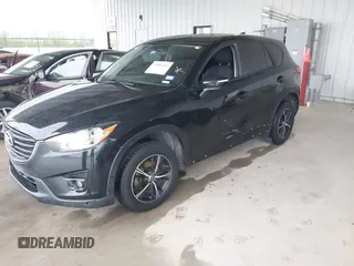 2016 Mazda CX-5 Touring with VIN JM3KE2CY2G0808424, listed as a IAAI auction lot 41880494 with 149,005 mi miles. Bid and sale history available at carsss.com. Image 6.