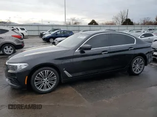 2018 BMW 5 Series 530e xDrive with VIN WBAJB1C5XJB084018, listed as a Copart auction lot 86277124 with 127,517 mi miles and Salvage Title. Bid and sale history available at carsss.com. Image 1.