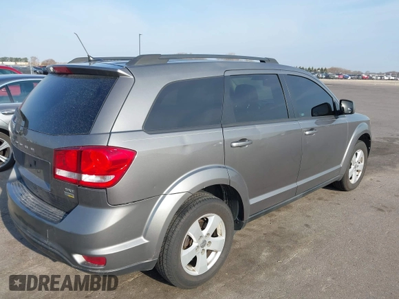 2012 Dodge Journey SXT z VIN 3C4PDCBG9CT208092, wystawiony jako IAAI lot #42065471 z przebiegiem 208 794 mil mil oraz . Historia ofert i sprzedaży dostępna na DreamBid. Obrazek 4.