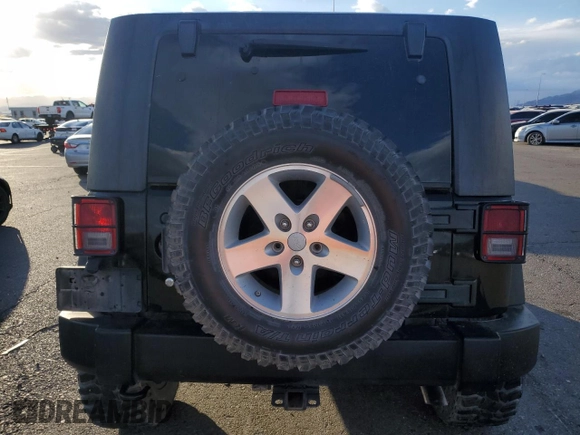2009 Jeep Wrangler Rubicon with VIN 1J4GA64119L762714, listed as a Copart auction lot 80943364 with Not Provided miles and Salvage Title. Bid and sale history available at DreamBid. Image 6.