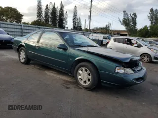 1994 Ford Thunderbird LX with VIN 1FALP62W6RH128762, listed as a Copart auction lot 84306604 with 68,314 mi miles and Salvage Title. Bid and sale history available at DreamBid. Image 4.