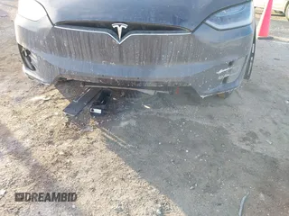 2017 Tesla Model X 90D with VIN 5YJXCDE23HF051321, listed as a IAAI auction lot 41415384 with 127,476 mi miles and . Bid and sale history available at carsss.com. Image 6.
