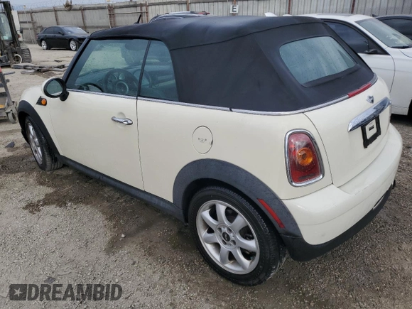 2010 MINI Convertible with VIN WMWMR3C52ATU96951, listed as a Copart auction lot 82038804 with 120,199 mi miles and Clean Title. Bid and sale history available at DreamBid. Image 2.