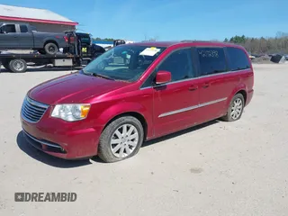 2014 Chrysler Town & Country Touring with VIN 2C4RC1BG8ER437451, listed as a IAAI auction lot 42172398 with 148,297 mi miles and . Bid and sale history available at DreamBid. Image 2.