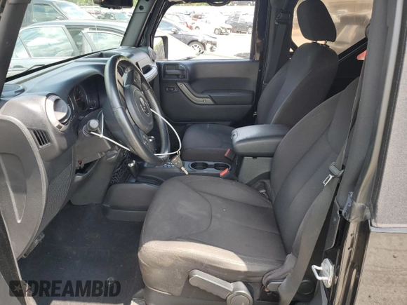 2015 Jeep Wrangler Freedom Edition with VIN 1C4AJWAG8FL688255, listed as a Copart auction lot 59722165 with 130,666 mi miles and Salvage title. Bid and sale history available at DreamBid. Image 7.