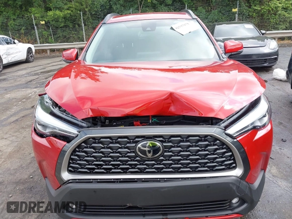 2022 Toyota Corolla Cross XLE z VIN 7MUEAABG0NV030757, wystawiony jako IAAI lot #42597979 z przebiegiem 20 172 mil mil oraz . Historia ofert i sprzedaży dostępna na DreamBid. Obrazek 6.