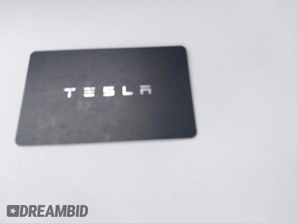 2021 Tesla Model 3 Long Range with VIN 5YJ3E1EB6MF878411, listed as a IAAI auction lot 41986947 with 71,978 mi miles and . Bid and sale history available at DreamBid. Image 11.