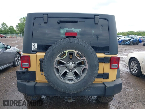 2014 Jeep Wrangler Rubicon with VIN 1C4BJWCG4EL145081, listed as a IAAI auction lot 42180723 with 113,659 mi miles and . Bid and sale history available at DreamBid. Image 16.