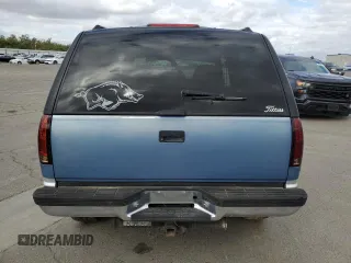 1995 GMC Yukon with VIN 1GKEK18K6SJ710419, listed as a Copart auction lot 80778474 with 215,789 mi miles and Salvage Title. Bid and sale history available at carsss.com. Image 6.