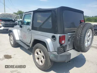 2015 Jeep Wrangler Sahara with VIN 1C4AJWBG1FL705900, listed as a Copart auction lot 62353275 with 64,866 mi miles and Salvage title. Bid and sale history available at DreamBid. Image 2.