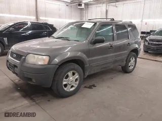 2004 Ford Escape XLT with VIN 1FMYU93174KA69760, listed as a IAAI auction lot 41725347 with 232,740 mi miles. Bid and sale history available at carsss.com. Image 2.