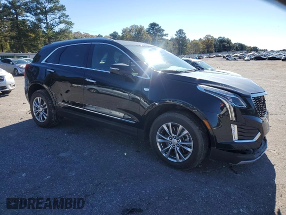 2023 Cadillac XT5 FWD Premium Luxury with VIN 1GYKNCR40PZ189444, listed as a Copart auction lot 84803094 with 22,827 mi miles and Clean Title. Bid and sale history available at carsss.com. Image 4.