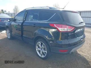 2014 Ford Escape Titanium with VIN 1FMCU9J93EUE27803, listed as a IAAI auction lot 42028249 with 131,194 mi miles and . Bid and sale history available at DreamBid. Image 3.