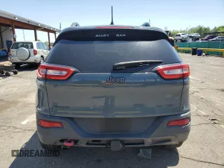 2014 Jeep Cherokee Trailhawk z VIN 1C4PJMBBXEW134939, wystawiony jako Copart lot #56579125 z przebiegiem 155 693 mil mil oraz Czysty tytuł • Clean title. Historia ofert i sprzedaży dostępna na DreamBid. Obrazek 6.