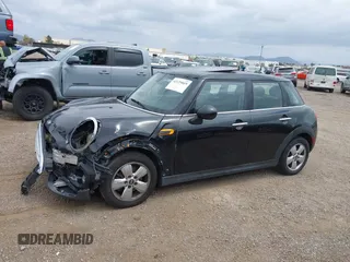 2015 MINI Hardtop 4 Door z VIN WMWXS5C58FT831568, wystawiony jako IAAI lot #42129819 z przebiegiem 76 044 mil mil oraz . Historia ofert i sprzedaży dostępna na DreamBid. Obrazek 15.