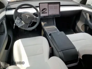 2024 Tesla Model Y Long Range with VIN 7SAYGDEE6RA290124, listed as a Copart auction lot 57662385 with 14,751 mi miles and Salvage title. Bid and sale history available at DreamBid. Image 8.