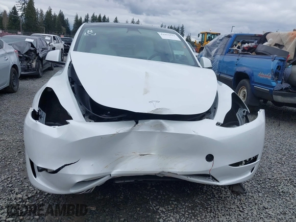 2023 Tesla Model Y Long Range z VIN 7SAYGAEEXPF647352, wystawiony jako IAAI lot #41955933 z przebiegiem Nie podano mil oraz . Historia ofert i sprzedaży dostępna na DreamBid. Obrazek 13.