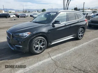 2019 BMW X1 xDrive28i with VIN WBXHT3C52K5N23533, listed as a Copart auction lot 50658905 with 31,211 mi miles and Salvage Title. Bid and sale history available at carsss.com. Image 1.