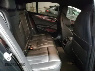 2018 BMW M5 z VIN WBSJF0C51JB282271, wystawiony jako Copart lot #60647265 z przebiegiem 63 765 mil mil oraz Szkoda całkowita • Salvage title. Historia ofert i sprzedaży dostępna na DreamBid. Obrazek 10.