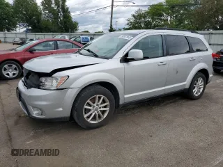 2014 Dodge Journey SXT z VIN 3C4PDDBG7ET156566, wystawiony jako Copart lot #56937945 z przebiegiem 137 067 mil mil oraz Szkoda całkowita • Salvage title. Historia ofert i sprzedaży dostępna na DreamBid. Obrazek 1.