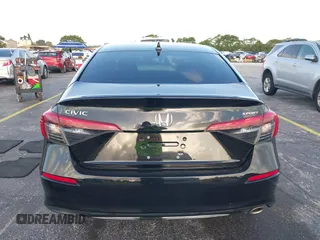 2022 Honda Civic Sport z VIN 2HGFE2F53NH569990, wystawiony jako IAAI lot #41944635 z przebiegiem 20 935 mil mil oraz . Historia ofert i sprzedaży dostępna na DreamBid. Obrazek 17.