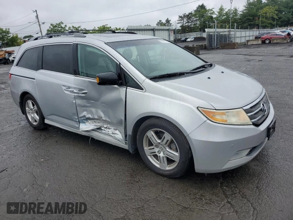 2011 Honda Odyssey Touring with VIN 5FNRL5H99BB021223, listed as a Copart auction lot 61171775 with 194,029 mi miles and Salvage title. Bid and sale history available at DreamBid. Image 4.