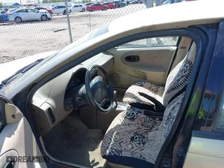 1996 Saturn SL with VIN 1G8ZH5288TZ230864, listed as a IAAI auction lot 42116703 with 104,387 mi miles. Bid and sale history available at carsss.com. Image 5.