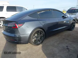 2019 Tesla Model 3 Long Range with VIN 5YJ3E1EB6KF413320, listed as a IAAI auction lot 41760428 with 90,441 mi miles and . Bid and sale history available at DreamBid. Image 4.
