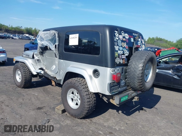 2005 Jeep Wrangler Unlimited with VIN 1J4FA44S55P352803, listed as a IAAI auction lot 42688284 with 128,586 mi miles and . Bid and sale history available at DreamBid. Image 3.