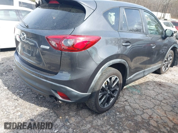 2016 Mazda CX-5 Grand Touring z VIN JM3KE4DY5G0836891, wystawiony jako IAAI lot #41441065 z przebiegiem 120 808 mil mil oraz . Historia ofert i sprzedaży dostępna na DreamBid. Obrazek 4.