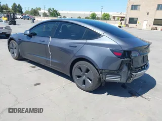 2023 Tesla Model 3 with VIN 5YJ3E1EAXPF405588, listed as a IAAI auction lot 42348952 with 30,788 mi miles and . Bid and sale history available at DreamBid. Image 3.