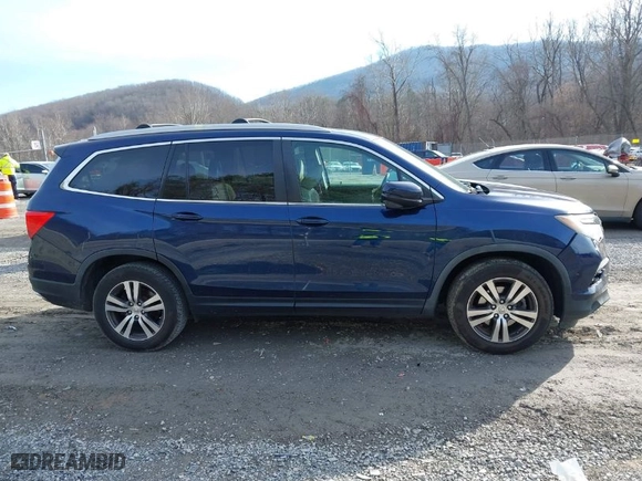 2017 Honda Pilot EX-L with VIN 5FNYF5H52HB031634, listed as a IAAI auction lot 41145133 with 164,668 mi miles. Bid and sale history available at carsss.com. Image 13.