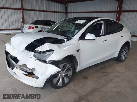 2023 Tesla Model Y Long Range z VIN 7SAYGDEE2PF834036, wystawiony jako IAAI lot #41933120 z przebiegiem 27 872 mil mil oraz . Historia ofert i sprzedaży dostępna na DreamBid. Obrazek 18.