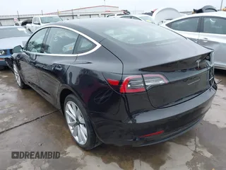 2018 Tesla Model 3 Long Range Battery with VIN 5YJ3E1EB3JF090567, listed as a IAAI auction lot 41568312 with 35,327 mi miles and . Bid and sale history available at DreamBid. Image 3.
