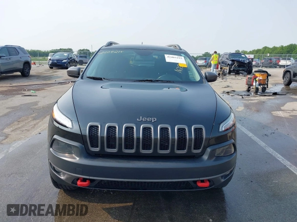 2015 Jeep Cherokee Trailhawk with VIN 1C4PJMBS6FW786622, listed as a IAAI auction lot 42403215 with 148,205 mi miles and . Bid and sale history available at DreamBid. Image 12.