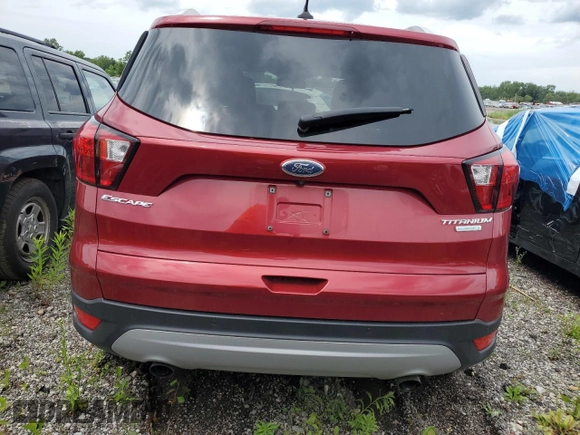 2019 Ford Escape Titanium with VIN 1FMCU0J98KUC00873, listed as a Copart auction lot 61674305 with 53,554 mi miles and Salvage title. Bid and sale history available at DreamBid. Image 6.