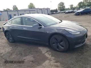 2018 Tesla Model 3 Long Range Battery z VIN 5YJ3E1EB3JF086972, wystawiony jako Copart lot #56290245 z przebiegiem 69 766 mil mil oraz Szkody całkowita. Historia ofert i sprzedaży dostępna na DreamBid. Obrazek 4.