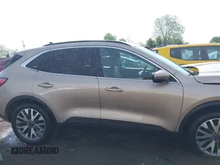 2020 Ford Escape Titanium z VIN 1FMCU9J92LUB48243, wystawiony jako IAAI lot #42143038 z przebiegiem 63 172 mil mil oraz . Historia ofert i sprzedaży dostępna na DreamBid. Obrazek 14.