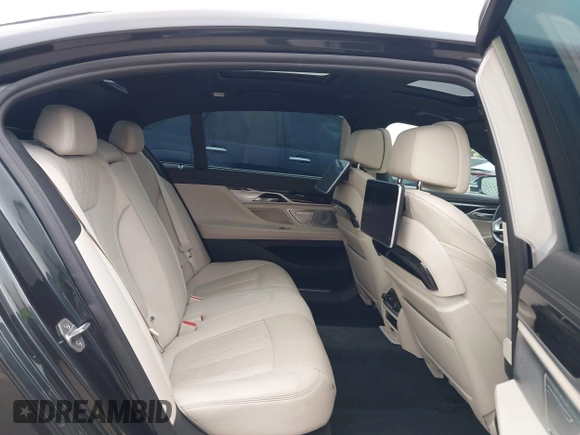 2019 BMW 7 Series 750i with VIN WBA7F0C50KGM26010, listed as a IAAI auction lot 42188421 with 71,576 mi miles and . Bid and sale history available at DreamBid. Image 8.