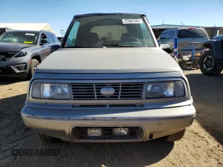 1995 Chevrolet Tracker z VIN 2CNBJ186XS6926688, wystawiony jako Copart lot #77487204 z przebiegiem 17 598 mil mil oraz Szkoda całkowita • Salvage title. Historia ofert i sprzedaży dostępna na DreamBid. Obrazek 5.
