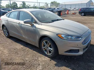 2015 Ford Fusion SE Hybrid with VIN 3FA6P0LU7FR243498, listed as a IAAI auction lot 42719986 with 345,098 mi miles and . Bid and sale history available at DreamBid. Image 1.