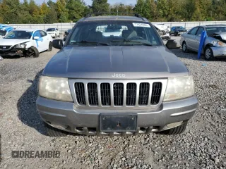 1999 Jeep Grand Cherokee Limited with VIN 1J4G268S7XC668348, listed as a Copart auction lot 77824084 with 165,779 mi miles and Salvage title. Bid and sale history available at DreamBid. Image 5.