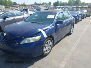 2009 Toyota Camry with VIN 4T1BE46K59U401572, listed as a IAAI auction lot 42059793 with 215,238 mi miles. Bid and sale history available at carsss.com. Image 2.