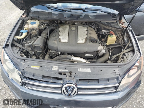 2012 Volkswagen Touareg Sport с VIN WVGEK9BP7CD006059, выставлен на аукционе Copart как лот 49411245 с пробегом 202 323 миль миль и Чистый • Clean title. История ставок и продаж доступна на DreamBid. Изображение 12.