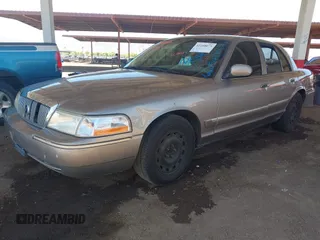 2004 Mercury Grand Marquis GS z VIN 2MEFM74W44X661154, wystawiony jako IAAI lot #42268675 z przebiegiem 236 456 mil mil oraz . Historia ofert i sprzedaży dostępna na DreamBid. Obrazek 2.