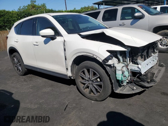 2017 Mazda CX-5 Grand Touring with VIN JM3KFBDL7H0202831, listed as a Copart auction lot 54943115 with 69,933 mi miles and Salvage Title. Bid and sale history available at carsss.com. Image 4.