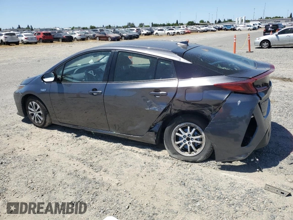 2021 Toyota Prius LE z VIN JTDKAMFPXM3190346, wystawiony jako Copart lot #57626675 z przebiegiem 102 786 mil mil oraz Szkoda całkowita • Salvage title. Historia ofert i sprzedaży dostępna na DreamBid. Obrazek 2.
